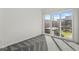 Bright bedroom with sliding glass doors opening to an outdoor patio featuring a hot tub at 1510 Columbia Ave, Indianapolis, IN 46202