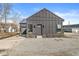 Charming home with modern dark siding, a garage, and a well-maintained front yard providing appealing curb appeal at 1510 Columbia Ave, Indianapolis, IN 46202