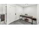 Bright home office space with desk, chair, and doorway to a storage area at 1510 Columbia Ave, Indianapolis, IN 46202