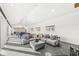 Open concept living space with large sectional sofa, tile floors, and natural light at 1510 Columbia Ave, Indianapolis, IN 46202