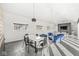 Open floor plan featuring a living room and dining area with sleek floors and modern lighting fixtures at 1510 Columbia Ave, Indianapolis, IN 46202