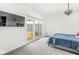 Well-lit bedroom with sliding doors to a private backyard, offering indoor-outdoor living at 1510 Columbia Ave, Indianapolis, IN 46202