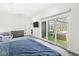 Bedroom with sliding glass doors to the pool area, providing a seamless transition to outdoor amenities at 1510 Columbia Ave, Indianapolis, IN 46202