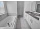 Elegant bathroom with a soaking tub, double vanity, and stylish tile work at 15704 Millwood Dr, Noblesville, IN 46060