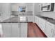 Well-equipped kitchen featuring granite countertops, modern appliances, and ample cabinet space at 15704 Millwood Dr, Noblesville, IN 46060