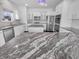 Modern kitchen featuring an island, stainless steel appliances, and sleek white cabinetry at 15704 Millwood Dr, Noblesville, IN 46060