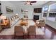 Inviting living room with cozy fireplace, plush seating, and hardwood floors, perfect for relaxation at 15704 Millwood Dr, Noblesville, IN 46060