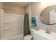 Clean and bright bathroom features a shower-tub combo and modern vanity at 1718 Gilmore St, Columbus, IN 47201