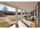 Inviting covered porch featuring comfortable seating and a view of the quiet neighborhood street at 1718 Gilmore St, Columbus, IN 47201