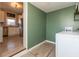The home's laundry room connects the kitchen to the laundry area and features tile flooring at 1718 Gilmore St, Columbus, IN 47201