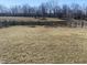 Large backyard with a weathered fence, providing ample room for recreation and gardening at 1735 Sonesta Ln, Indianapolis, IN 46217