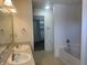 A large Primary bathroom features dual sinks, a tub, and access to a walk-in closet at 1735 Sonesta Ln, Indianapolis, IN 46217