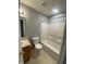 Standard bathroom with essential fixtures: toilet, vanity, mirror, and a shower-tub combination at 1735 Sonesta Ln, Indianapolis, IN 46217