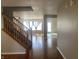 Inviting entryway with hardwood floors and a staircase leading to the upper level at 1735 Sonesta Ln, Indianapolis, IN 46217