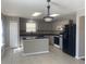 Spacious kitchen features an island, sleek counters, and modern appliances for a chef-friendly setup at 1735 Sonesta Ln, Indianapolis, IN 46217