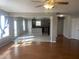 Open-concept space featuring hardwood floors, a view into the kitchen, and plenty of natural light at 1735 Sonesta Ln, Indianapolis, IN 46217