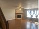 Spacious living room featuring wood floors, a fireplace, and natural light at 1735 Sonesta Ln, Indianapolis, IN 46217