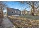 View of the home's backyard with garden beds and a blue sky at 1953 N Linwood Ave, Indianapolis, IN 46218