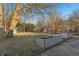 Spacious backyard featuring gardening beds and mature trees for shade at 1953 N Linwood Ave, Indianapolis, IN 46218