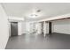 Spacious basement has painted walls, and ceilings, and multiple doorways at 1953 N Linwood Ave, Indianapolis, IN 46218