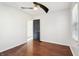 A clean bedroom shows an open door, hardwood floors and light from the window at 1953 N Linwood Ave, Indianapolis, IN 46218