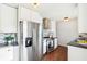 Modern kitchen featuring stainless steel appliances, white cabinets, and stylish countertops, offering a functional cooking space at 1953 N Linwood Ave, Indianapolis, IN 46218