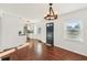 Inviting living room with hardwood floors, a stylish chandelier, and easy access to the adjacent kitchen at 1953 N Linwood Ave, Indianapolis, IN 46218
