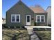 Charming home features meticulous landscaping, covered porch, and a well-maintained exterior at 2341 California St, Columbus, IN 47201