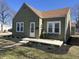 Charming home features meticulous landscaping, covered porch, and a well-maintained exterior at 2341 California St, Columbus, IN 47201