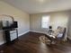 Bright living room features wood floors and natural light at 2341 California St, Columbus, IN 47201