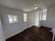 Bright room with a back door, two windows and hardwood flooring at 2341 California St, Columbus, IN 47201
