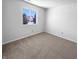 This bedroom is a blank canvas with a window providing natural light and neutral carpeting for comfort at 2365 Grand Fir Dr, Greenwood, IN 46143