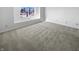 Bedroom is a blank canvas with a window providing natural light and neutral carpeting for comfort at 2365 Grand Fir Dr, Greenwood, IN 46143
