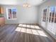 Sunlit dining area with new flooring and patio doors to backyard at 2365 Grand Fir Dr, Greenwood, IN 46143