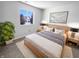 Cozy bedroom with a large window, stylish lamps, and a comfortable bed topped with decorative pillows at 2365 Grand Fir Dr, Greenwood, IN 46143