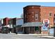 Street view of the brick building Carey on Main sports bar and grill and a UPS truck at 24403 Stout St, Sheridan, IN 46069