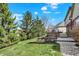 Landscaped backyard with brick patio and mature trees at 2750 Joshua Dr, Carmel, IN 46033