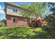 A charming backyard provides an outdoor area with a brick home and green lawn at 2750 Joshua Dr, Carmel, IN 46033