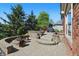 Stunning backyard featuring a custom stone patio with a firepit, barbecue and plenty of space for entertaining at 2750 Joshua Dr, Carmel, IN 46033