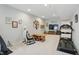Spacious finished basement provides flexible living space for recreation and exercise with treadmill at 2750 Joshua Dr, Carmel, IN 46033