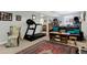 Finished basement showcases exercise equipment, accent rug, and seating at 2750 Joshua Dr, Carmel, IN 46033