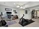 Finished basement features exercise area with desk and guitar at 2750 Joshua Dr, Carmel, IN 46033