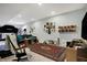 Basement features a rug, exercise equipment, couch, and accent pillows at 2750 Joshua Dr, Carmel, IN 46033