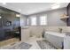 Modern bathroom features a glass shower, free-standing tub, and neutral color palette at 2750 Joshua Dr, Carmel, IN 46033