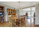 Dining room with hardwood floors, stylish lighting, and view to the Gathering room at 2750 Joshua Dr, Carmel, IN 46033
