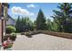A charming brick patio offers an outdoor area for relaxing and entertaining with potted plants at 2750 Joshua Dr, Carmel, IN 46033