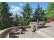 Outdoor patio with a fire pit and decorative landscaping creates a tranquil and inviting atmosphere at 2750 Joshua Dr, Carmel, IN 46033