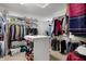 Walk-in closet offers storage with a center island and shelving at 2750 Joshua Dr, Carmel, IN 46033