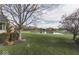 Beautiful backyard with pond view and mature trees, offering a serene and picturesque outdoor setting at 2861 Shadwell Pl, Greenwood, IN 46143