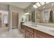 Elegant bathroom boasts double sinks, large mirrors, and walk-in shower offering style and functionality at 2861 Shadwell Pl, Greenwood, IN 46143